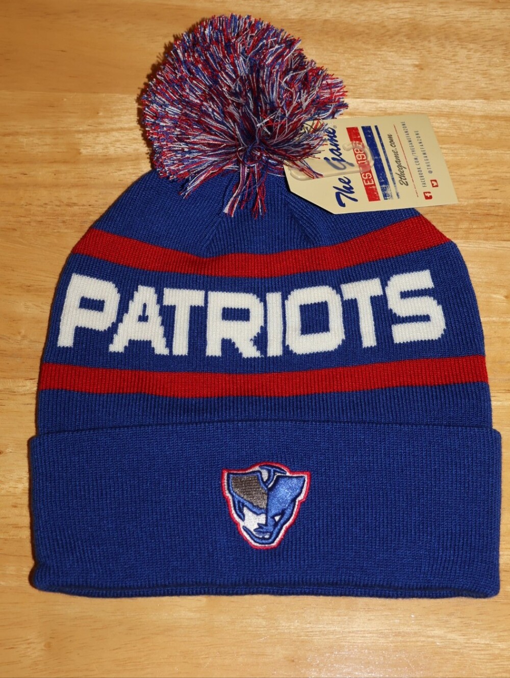The Game New England Patriots Unisex Roll-Up Beanie With Pom Pom.